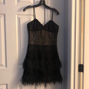 Black cocktail dress with feathers